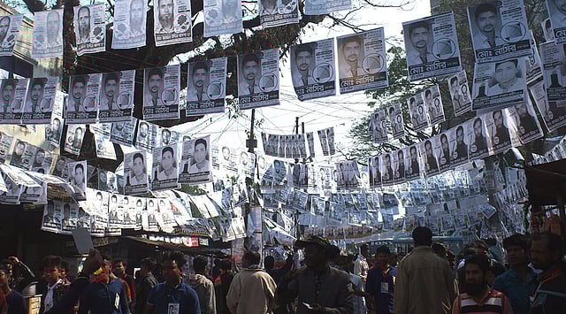 Posters are everywhere, for the triennial elections of district CNG-run auto rickshaw workers’ union at Zero Point of Mymensingh on 18 January. Photo: Anwar Hossain