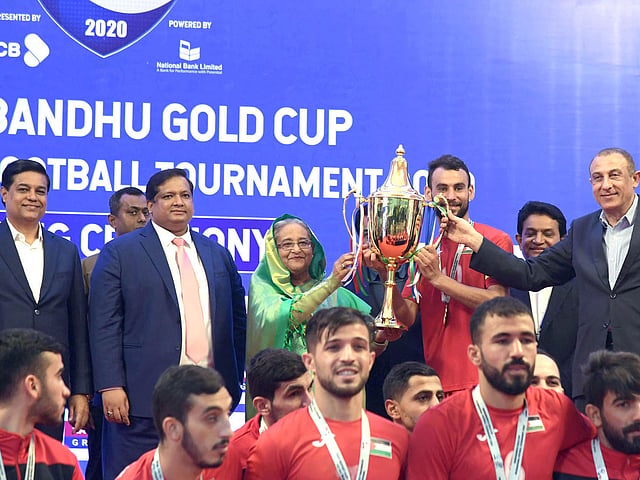 Bangladesh prime minister Sheikh Hasina hands over the trophy of Bangabandhu Gold Cup International Football Tournament-2020 to champions Palestine at Bangabandhu National Stadium, Dhaka on 25 January 2020. Photo: PID