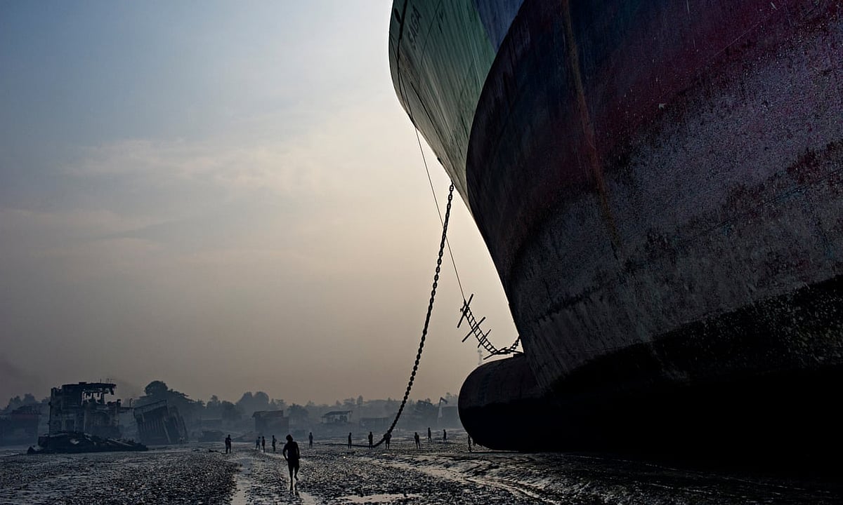 A huge freighter towers over a beach in Chittagong, where it will be disassembled and its parts recycled. Such work has caused countless injuries and fatalities. Photo: The Guardian