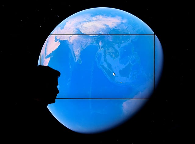 In this file photo taken on 18 April 2017 a man looks at a Google Earth map on a screen as Google Earth unveils the revamped version of the application at a event at New York`s Whitney Museum of Art. Photo: AFP