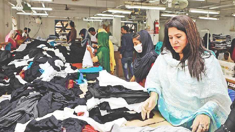 Baby Hassan (R) inspects items at BS Apparels, her own enterprise, in Chattogram. A recent photo by Sowrav Das