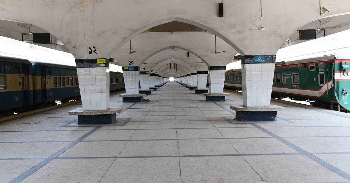 Empty platform of Kamalapur railway station while two trains standing on two lines.