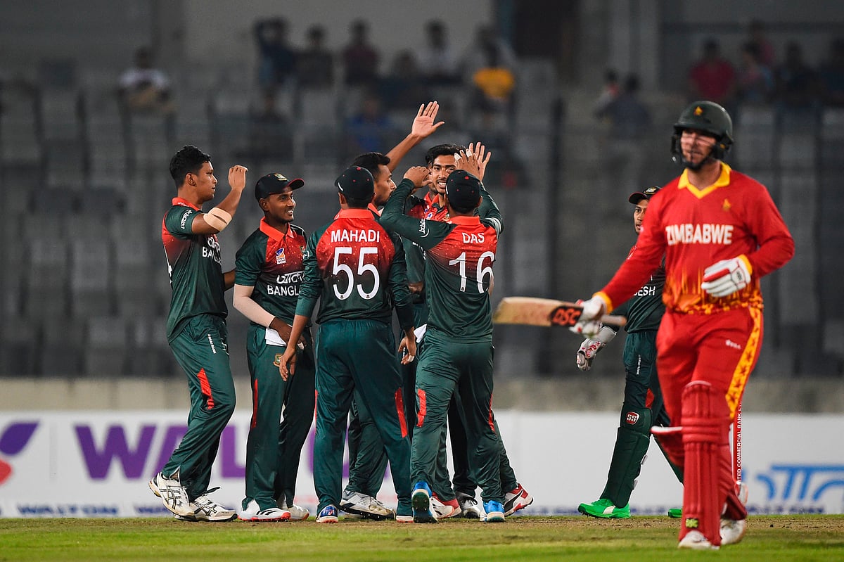 Bangladesh's cricketers celebrate the dismissal of Zimbabwe's Brendan Taylor (R) in the first match of the two-match T20I series at Sher-e-Bangla National Cricket Stadium in Dhaka on 9 March 2020.