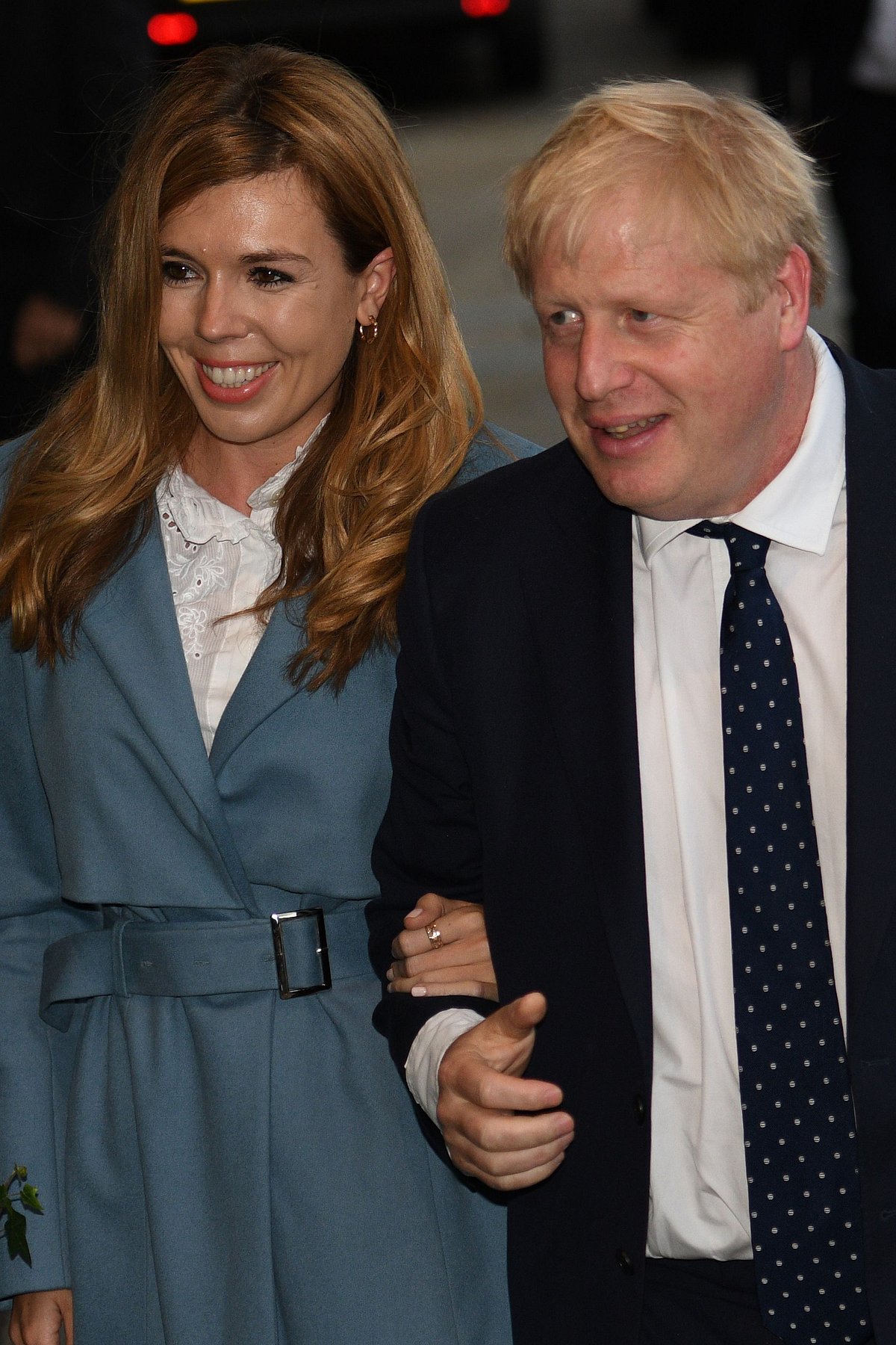 In this file photo taken on 28 September 2019 Britain's prime minister Boris Johnson (R) walks with his partner Carrie Symonds as they arrive at The Midland, near the Manchester Central convention complex in Manchester, northwest England, on the eve of the annual Conservative Party conference. Photo: AFP