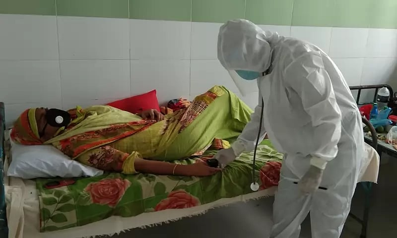 Kamrul Azad treating a patient at Barguna General Hospital