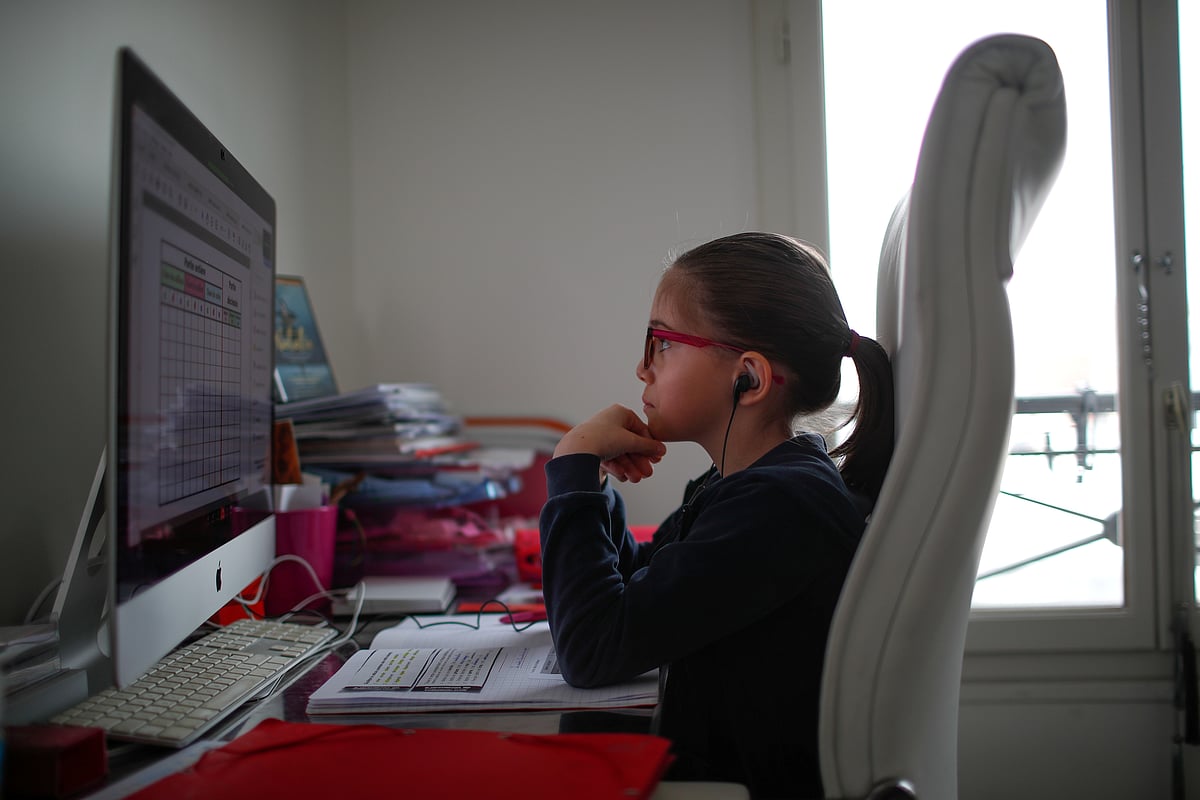 Anais, a student at the International Bilingual School (EIB), attends her online lessons in her bedroom in Paris as a lockdown is imposed to slow the rate of the coronavirus disease (COVID-19) spread in France, 20 March 2020