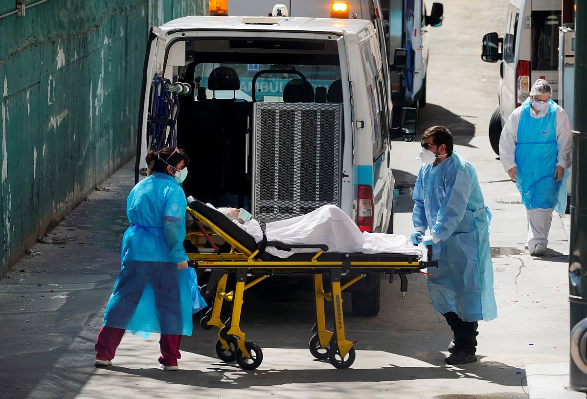 Ambulance workers pushes a stretcher with a patient at a nursing home during the coronavirus disease (COVID-19) outbreak in Leganes Madrid, near Madrid, Spain, 2 April 2020.