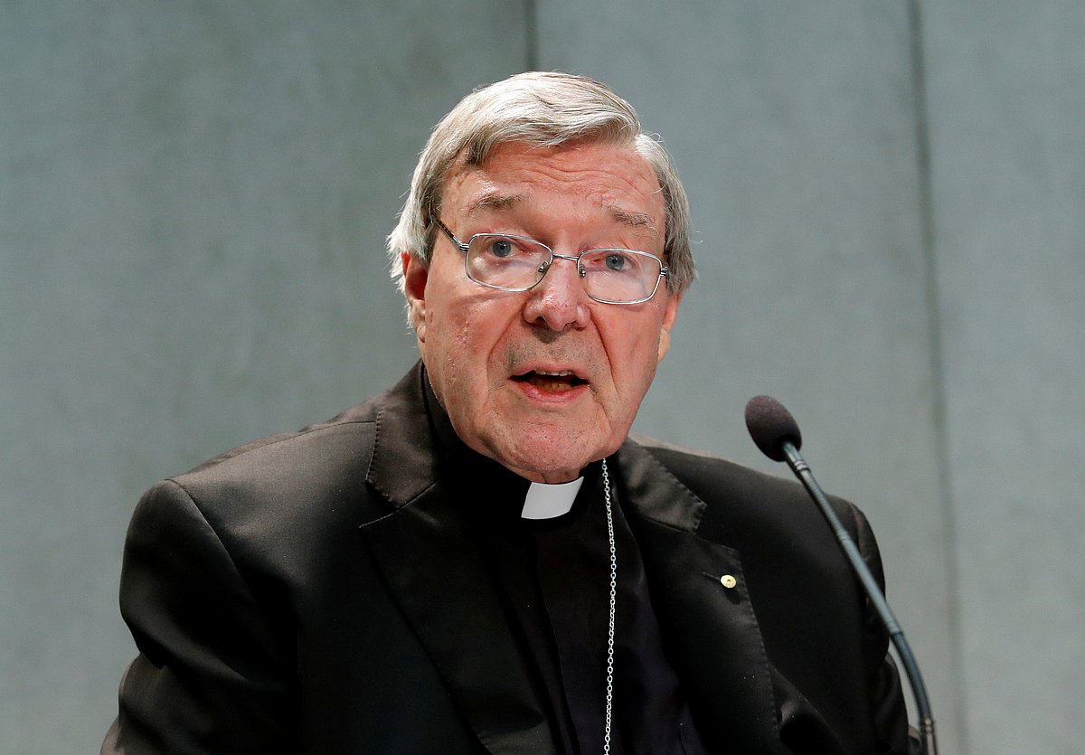 Cardinal George Pell attends a news conference at the Vatican.