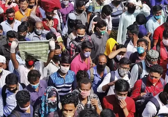 Hundreds of readymade garments workers are returning to Dhaka as the authorities declared to open garments factories. The photo is taken from Shimulia ferry ghat on Saturday.