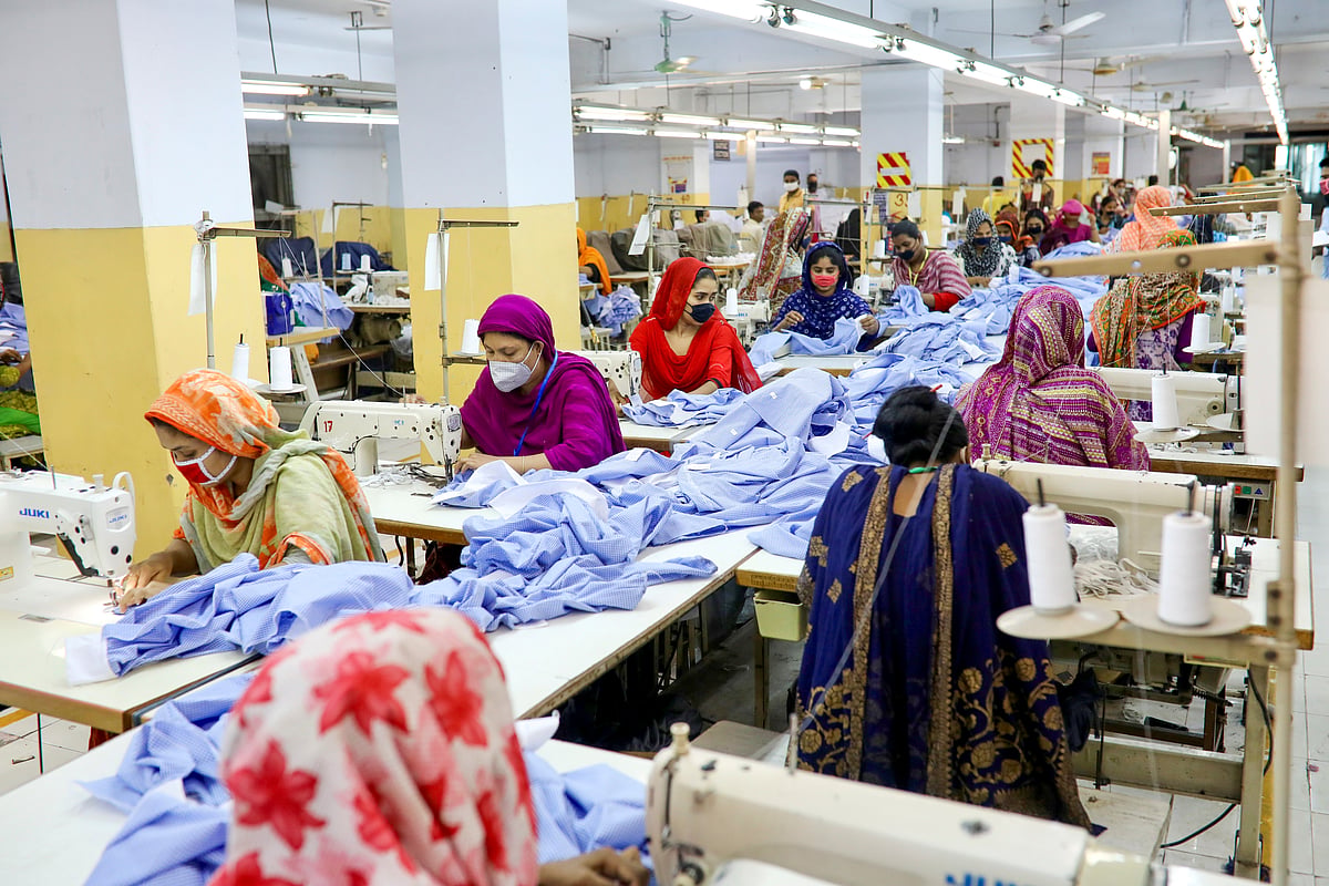 Women work in a garment factory, as factories reopened after the government has eased the restrictions amid concerns over the coronavirus disease (COVID-19) outbreak in Dhaka, Bangladesh, on 3 May 2020