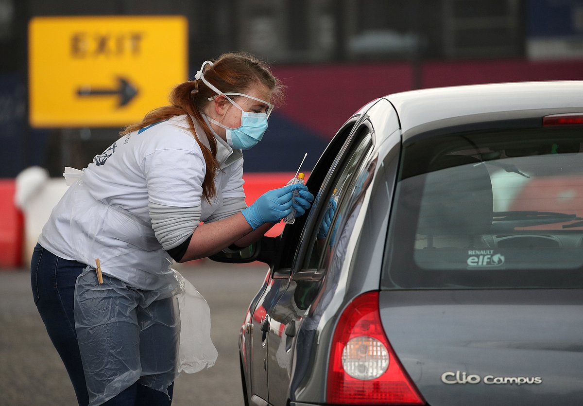 A staff member takes a sample at a COVID-19 testing centre amid the coronavirus disease outbreak, at Glasgow Airport, in Glasgow, Scotland 29 April 2020.