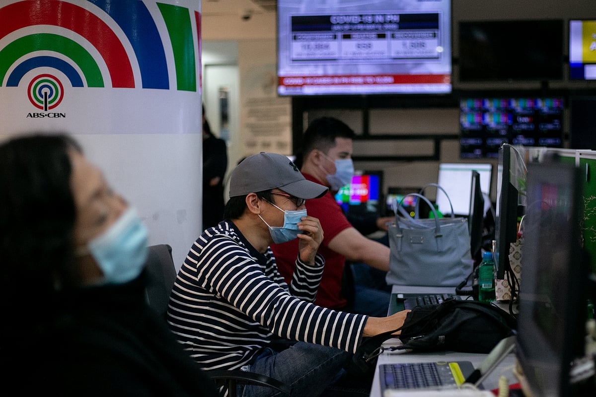 Writers and editors of ABS-CBN  work at the newsroom in their headquarters, in Quezon City, Metro Manila, Philippines, 6 May