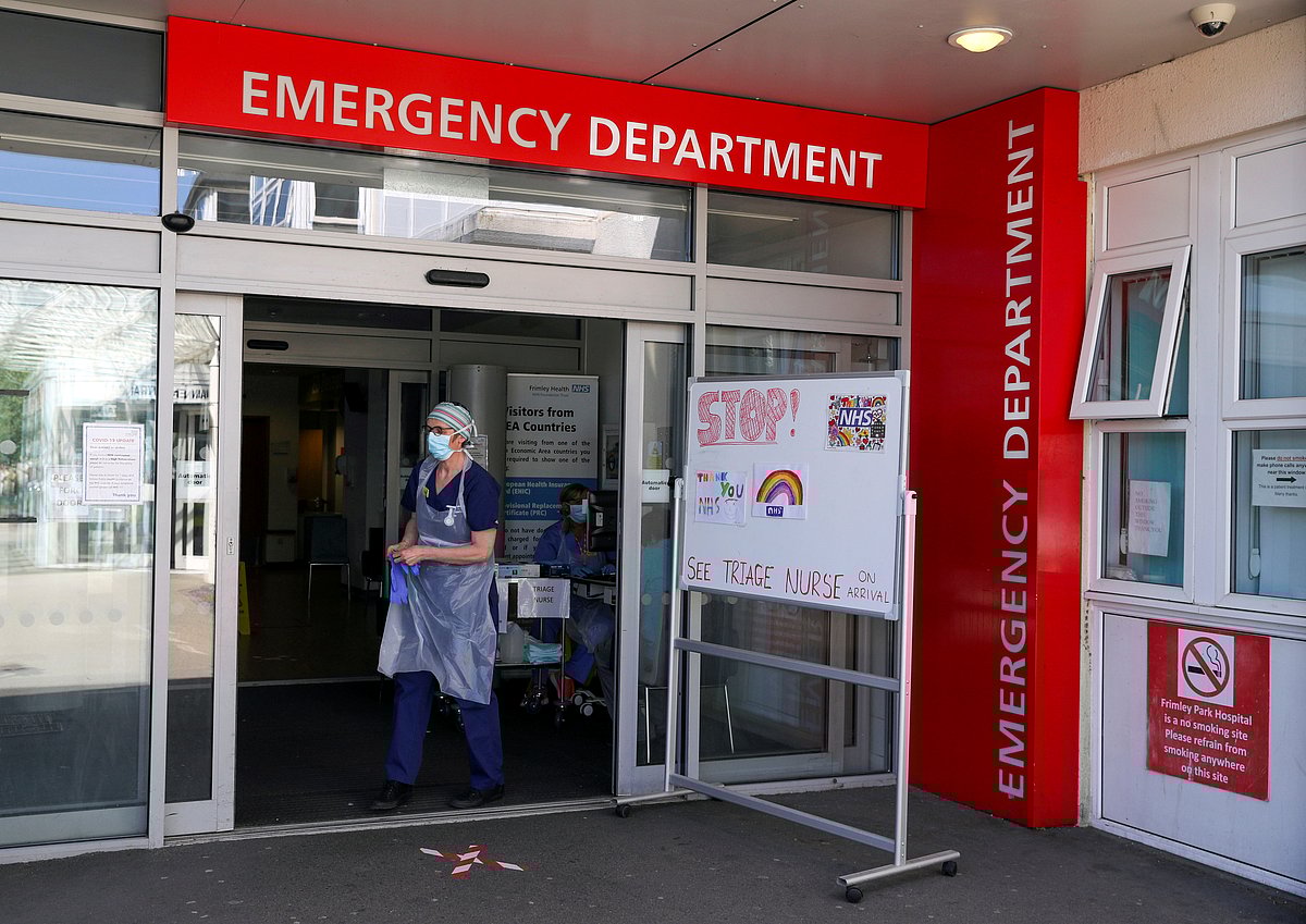 A triage nurse waits for patients in the Emergency Department at Frimley Park Hospital in Surrey, Britain, 22 May 2020.