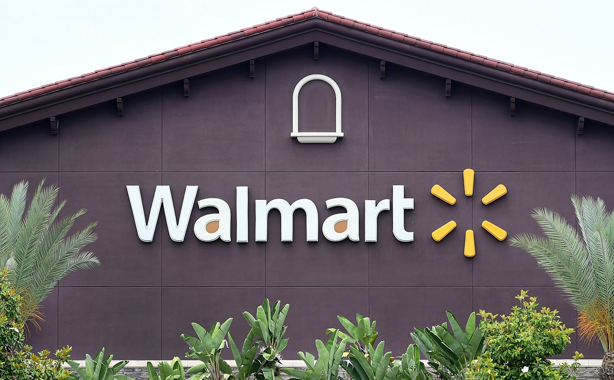 In this file photo taken on 23 May 2019 a Walmart store logo is seen on the building of a Walmart Supercenter in Rosemead, California. - At least two people were killed and four wounded in a shooting at a Walmart distribution center in California, US media reported on 27 June 2020.