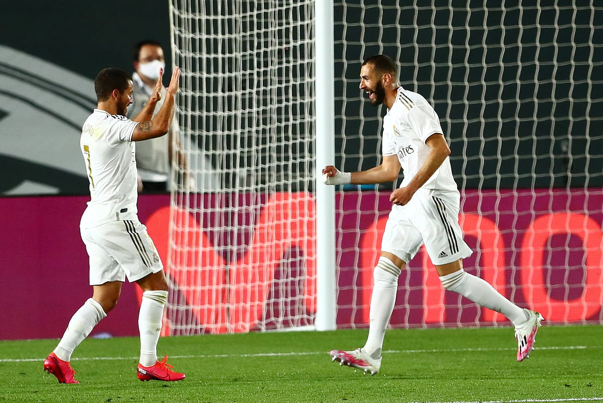 Real Madrid's Karim Benzema celebrates scoring their first goal with Eden Hazard as play resumes behind closed doors following the outbreak of the coronavirus disease (COVID-19) at Alfredo Di Stefano Stadium, Madrid, Spain on 18 June 2020