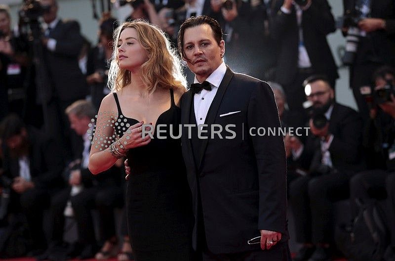 Actor Johnny Depp and his wife Amber Heard attend the red carpet event for the movie ‘Black Mass’ at the 72nd Venice Film Festival in northern Italy 4 September, 2015.