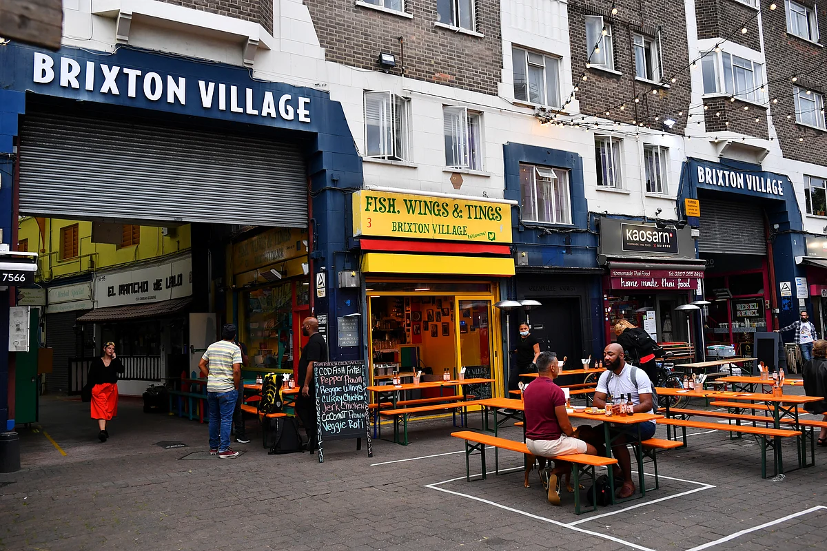 Empty tables are seen during a quiet night at Brixton Village, as the outbreak of the coronavirus disease (COVID-19) continues to affect businesses, in London, Britain, 14 July 2020.