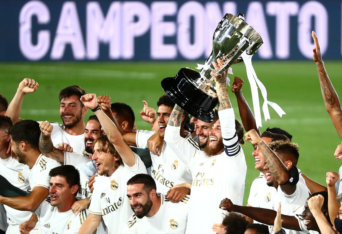 Real Madrid's Sergio Ramos and teammates celebrate with the trophy after winning La Liga title at Alfredo Di Stefano Stadium, Madrid, Spain on 16 July 2020