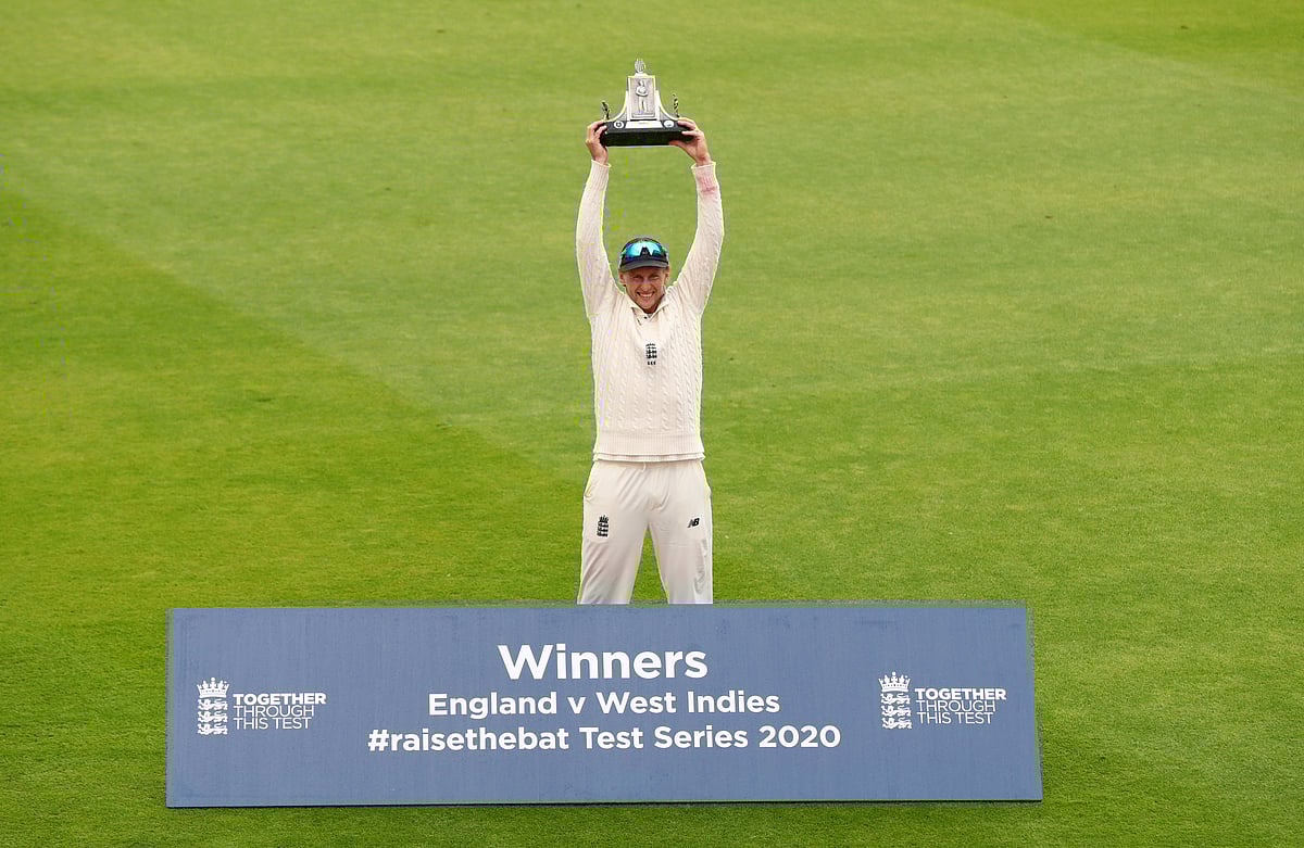 England's Joe Root celebrates winning the test series as he poses with the Wisden trophy by himself, after play resumed behind closed doors following the outbreak of the coronavirus disease (COVID-19)