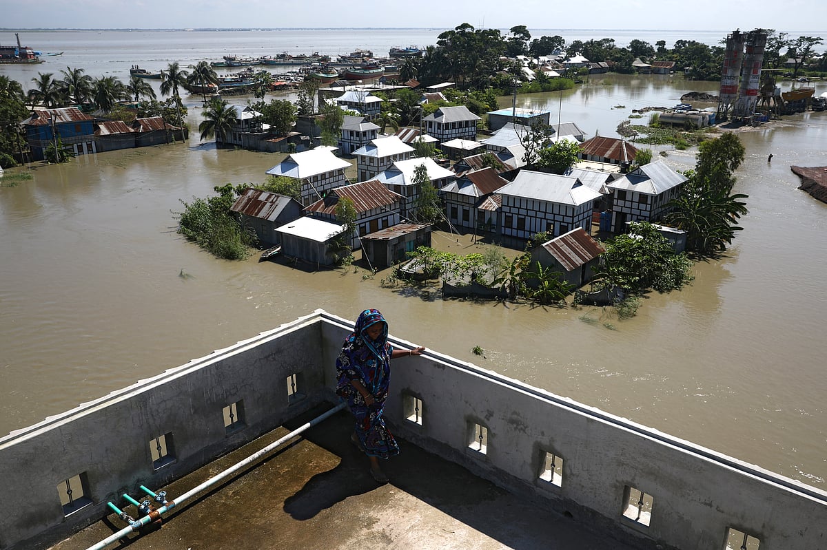 Houses located beside the Padma river are seen flooded as the flood situation worsens in Munshiganj district, on the outskirts of Dhaka, outskirts of Dhaka, Bangladesh, 25 July 2020.