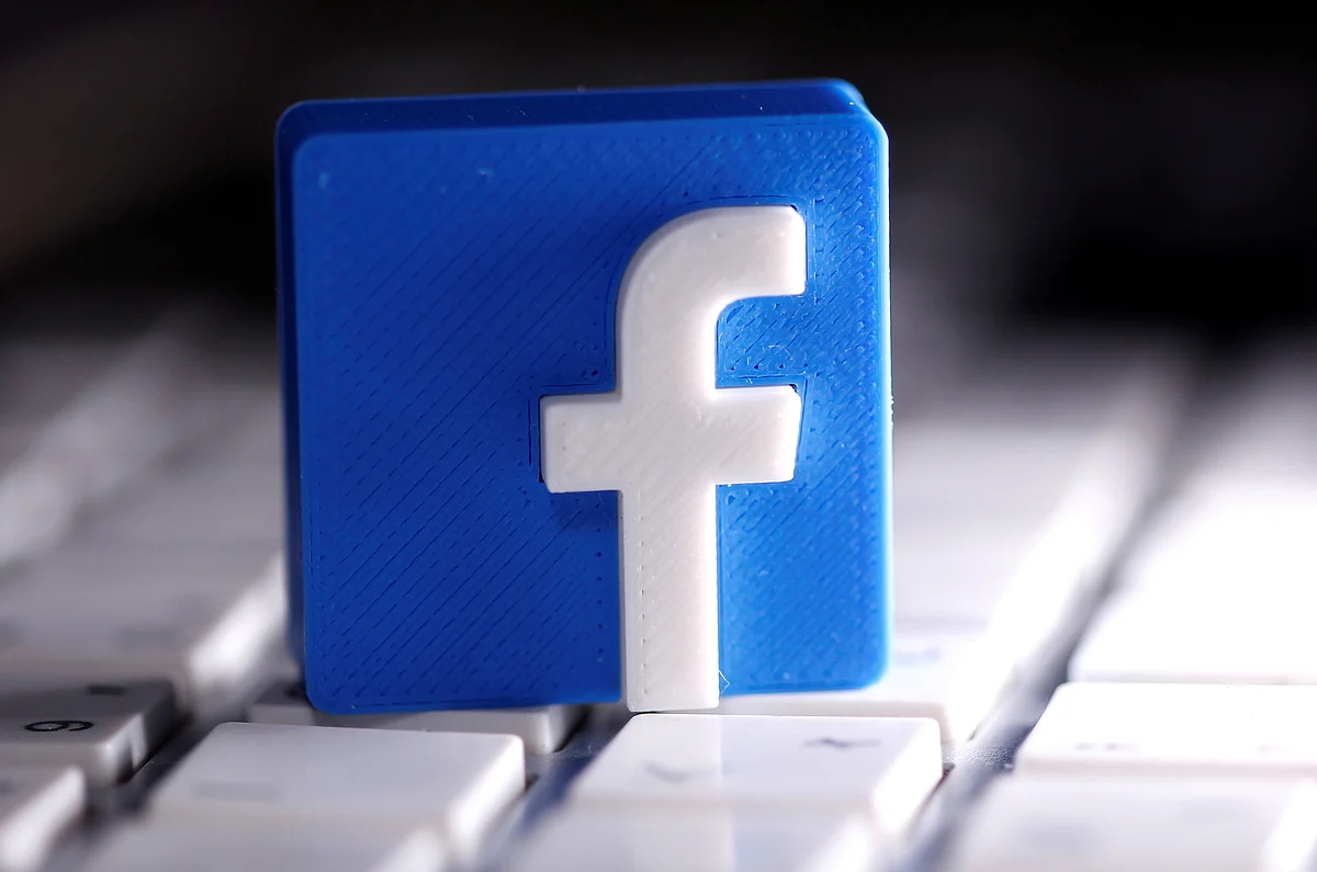 A 3D-printed Facebook logo is seen placed on a keyboard in this illustration taken 25 March 2020.