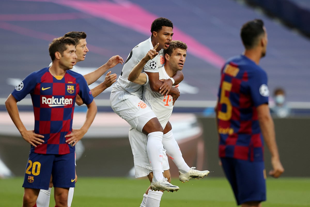 Bayern Munich's Thomas Muller celebrates scoring their first goal with Serge Gnabry in the Champions League Quarter Final against Barcelona at Estadio da Luz, Lisbon, Portugal on 14 August 2020