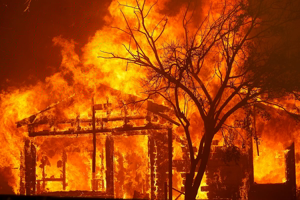A burning home is seen along Cherry Glen Road during the LNU Lighting Complex Fire on the outskirts of Vacaville, California, US on 19 August.