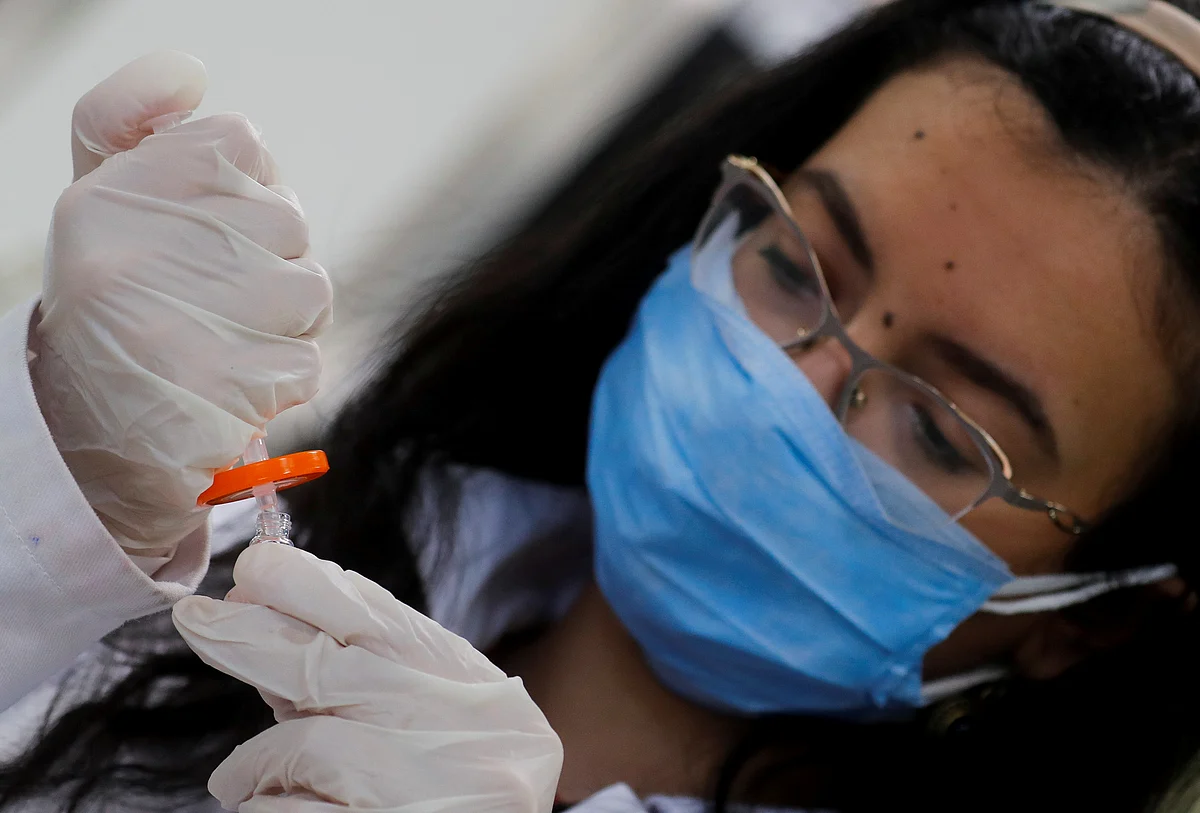 A pharmacist doctor works on the basics of the raw materials for investigational of the coronavirus disease (COVID-19) treatment drug "Remdesivir", in Ibn Sina laboratory, at Eva Pharma Facility in Cairo, Egypt, 25 June 2020.
