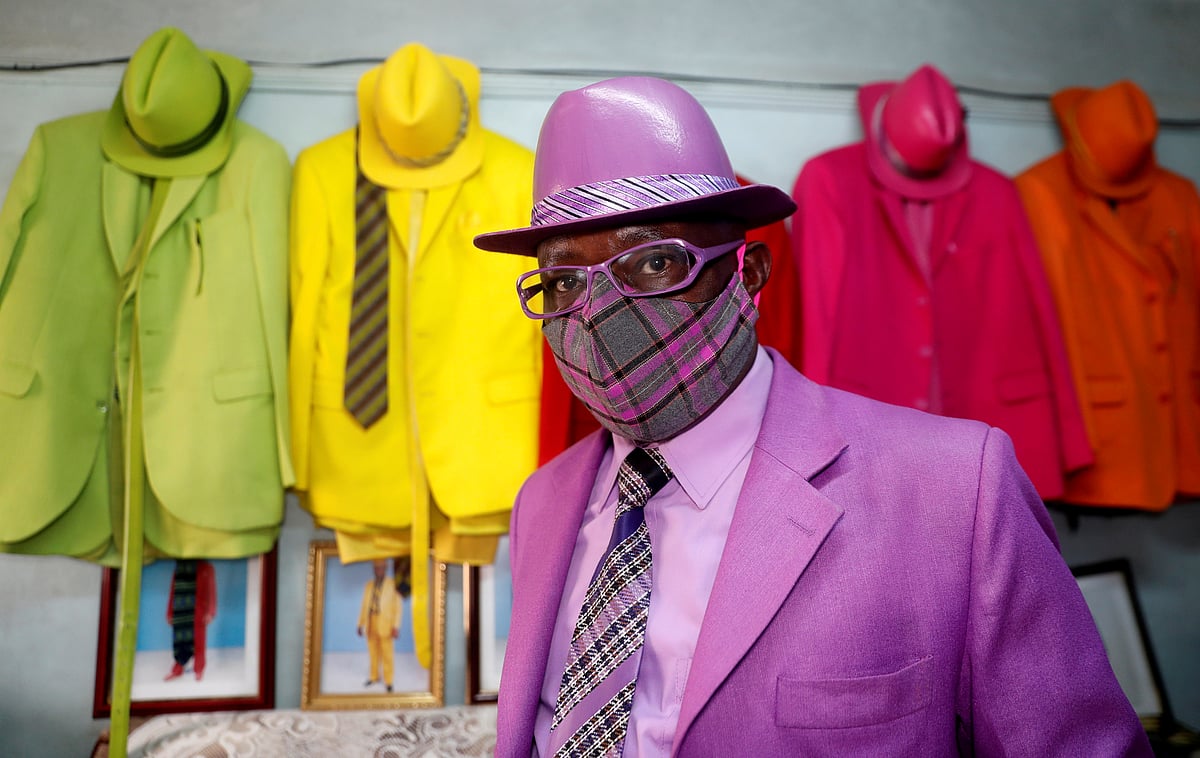 Kenyan fashionista James Maina Mwangi poses for a photograph as he displays his attire comprising at least 160 suits with matching accessories including a mask to prevent the coronavirus disease (COVID-19) infection at his residence in Nairobi, Kenya, 30 July 2020.