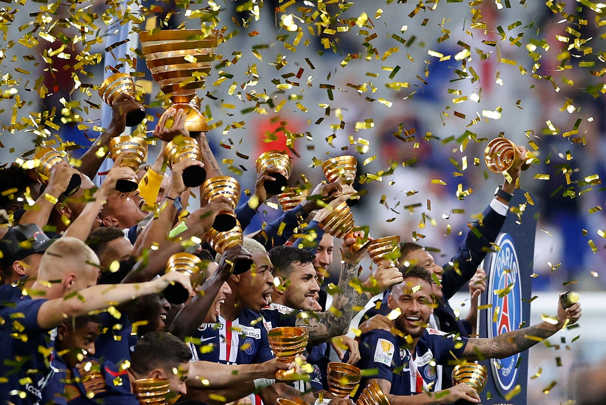 Paris St Germain's Thiago Silva and teammates celebrate with the trophy after winning the Coupe de la Ligue, following the outbreak of the coronavirus disease (COVID-19) in Saint-Denis near Paris, France on 31 July, 2020.