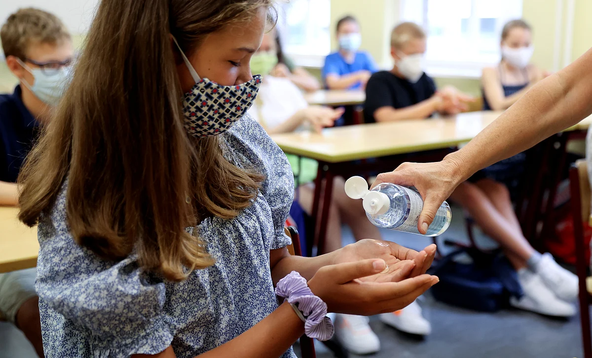 Pupils of the protestant high school "Zum Grauen Kloster" attend a lesson on the first day after the summer holidays in Berlin
