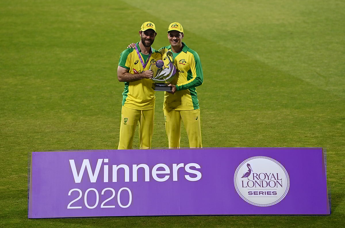 Third One Day International - England v Australia - Emirates Old Trafford, Manchester 16 September 2020 Australia's Glenn Maxwell and Alex Carey pose with the trophy after winning the match and the series.