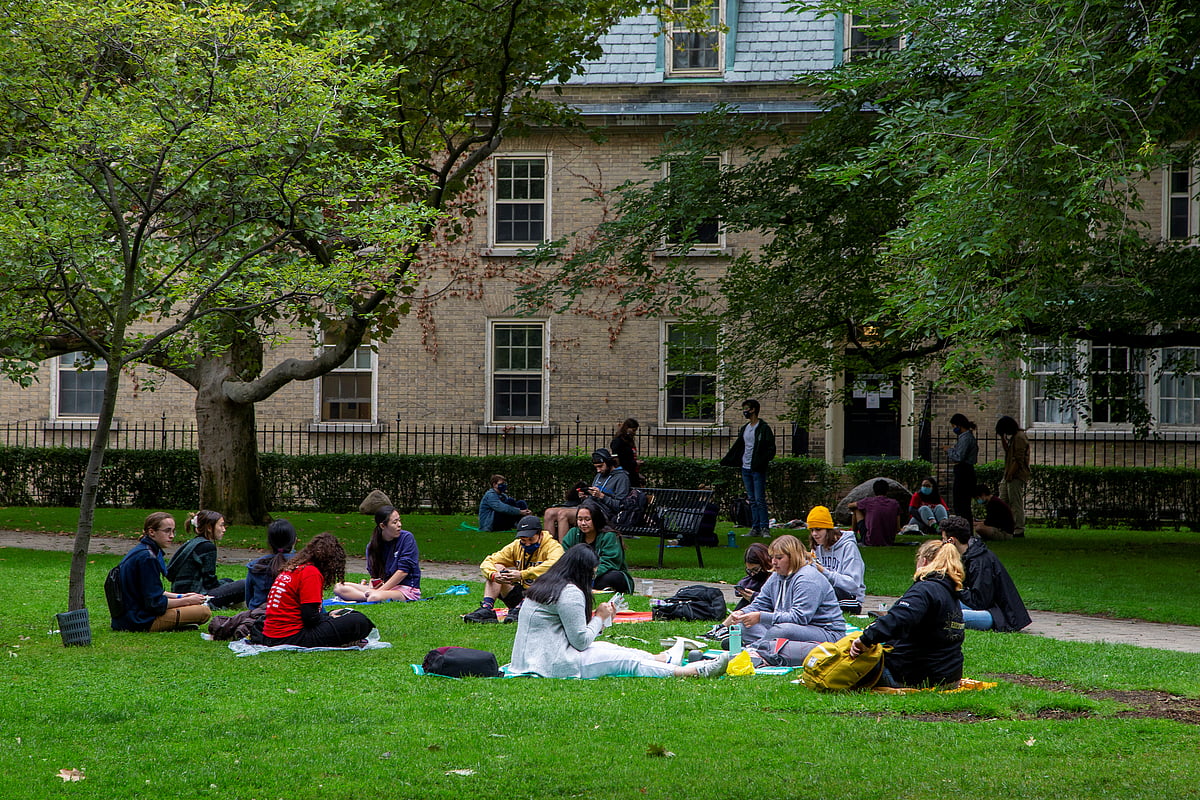 People sit on the grounds of the University of Toronto in Toronto, Ontario, Canada 9  2020