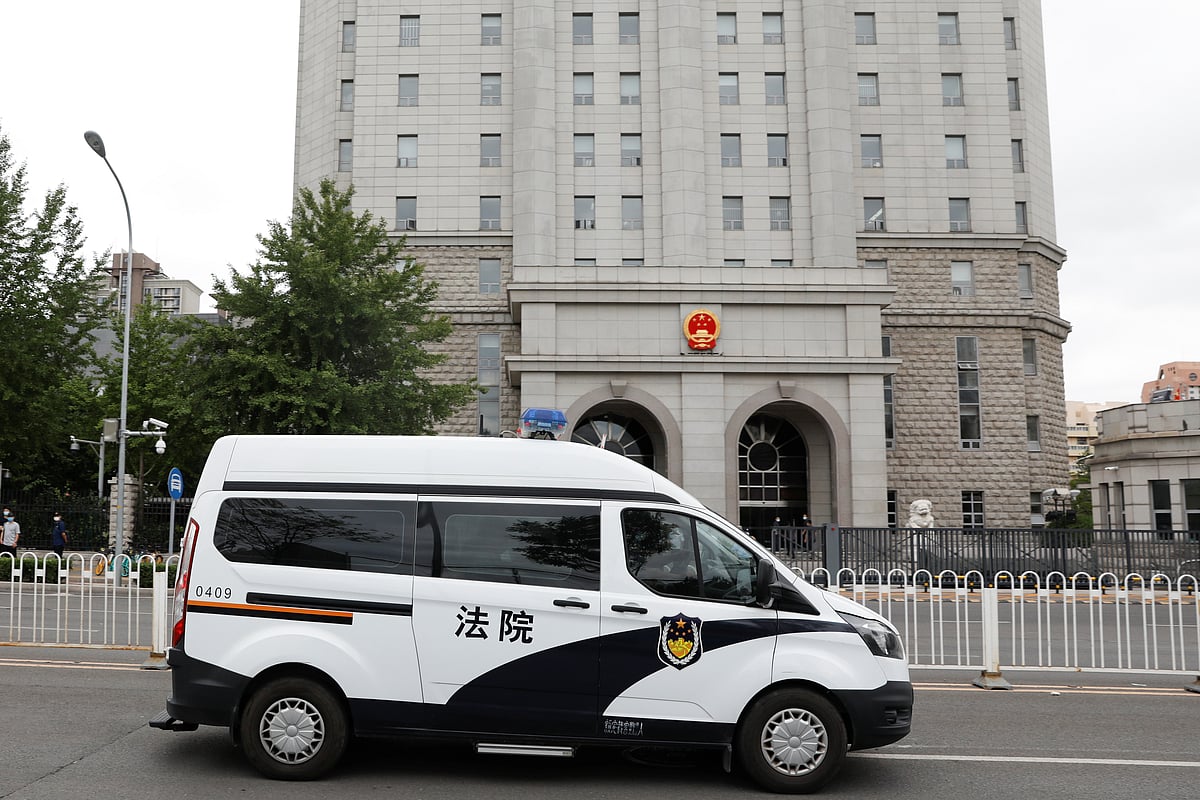 An escorted police van believed to be carrying Huayuan Real Estate Group former chairman Ren Zhiqiang leaves Beijing No. 2 Intermediate People's Court, where Ren faces corruption trial, in Beijing, China 11 September 2020.