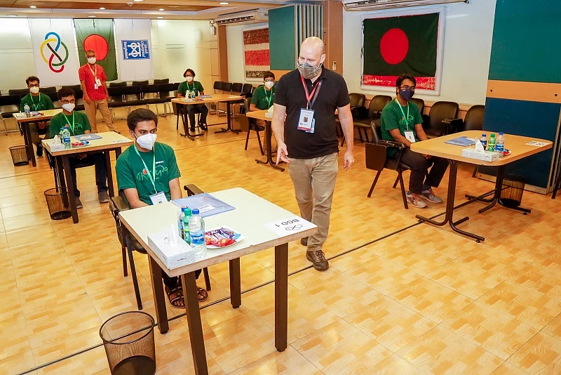 AIS/D teacher Ken Adler invigilates the first day of the 61st International Math Olympiad in Bangladesh at the Prothom Alo training room on 21 September