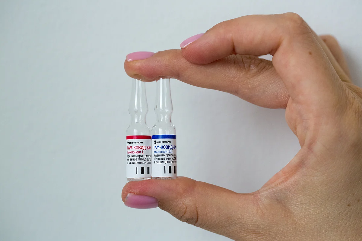 A photo shows an employee demonstrating vials with vaccine against the coronavirus disease (COVID-19) near Moscow