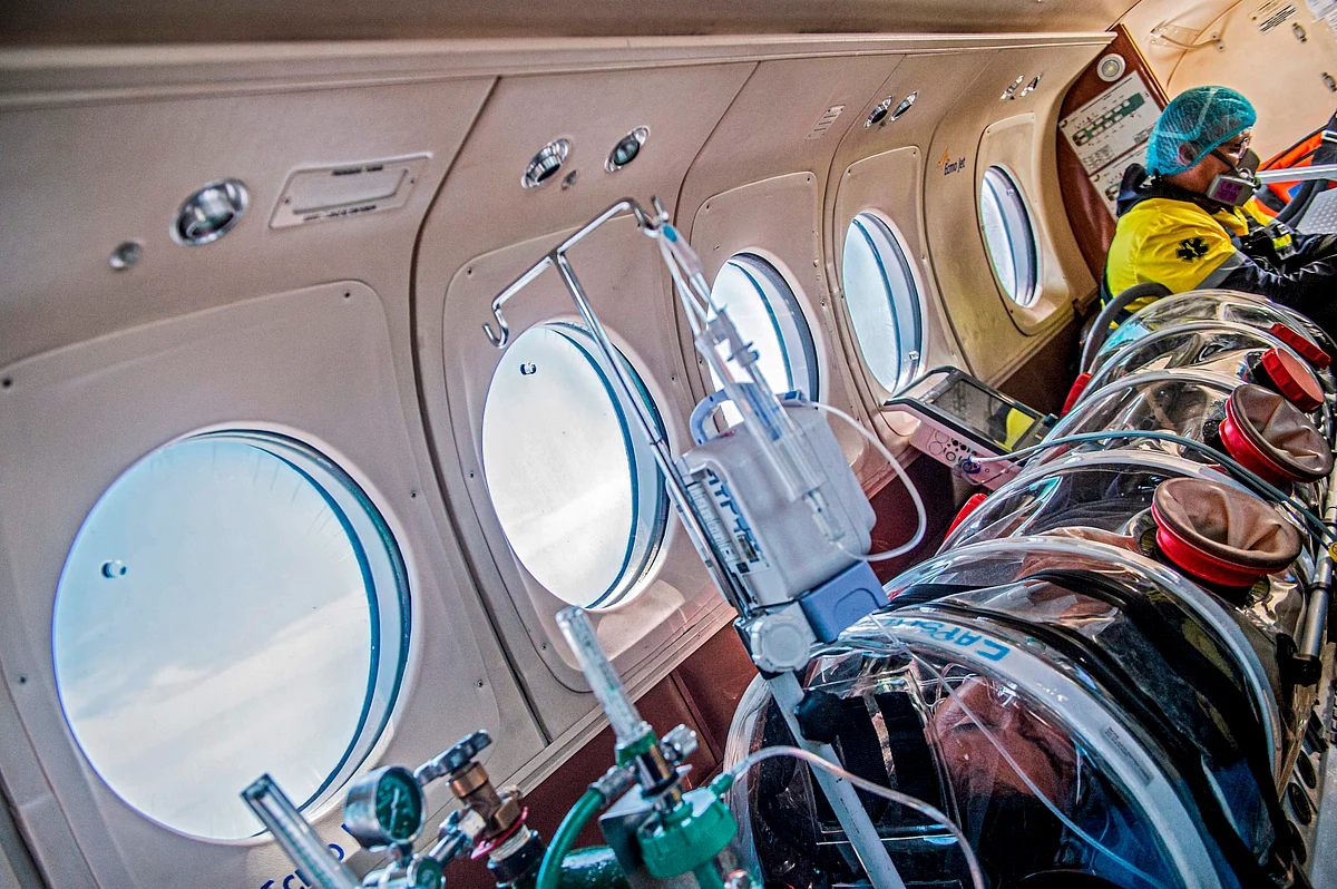 A patient with COVID-19, remains inside a security capsule in an air ambulance transferring him from Iquitos to the Intensive Care Unit of the Rebagliati Hospital, in Lima, on 1 September 2020.