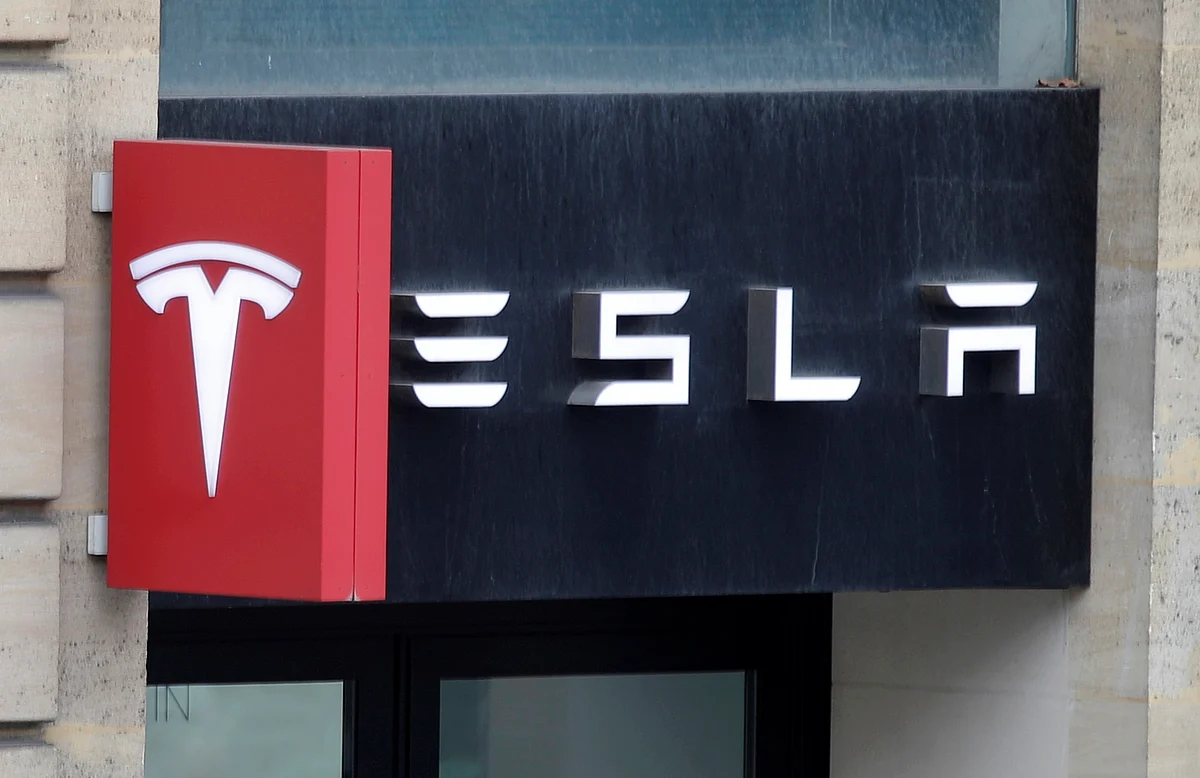 The logo of Tesla is seen on a store in Paris, France, 30 October, 2020.