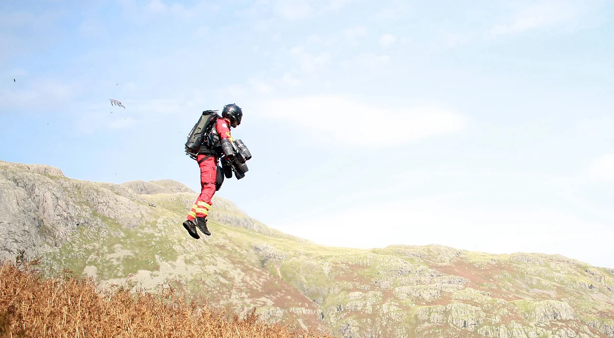 A handout picture released on 25 September 2020 by the Great North Air Ambulance Service (GNAAS) shows Gravity Industries founder and pilot Richard Browning taking part in a test flight of his jet-powered suit at Langdale pikes in the Lake District. Emergency responders and engineers in Britain said today they have successfully tested "the world's first jet suit paramedic", which could transform how life-savers reach isolated casualty sites.