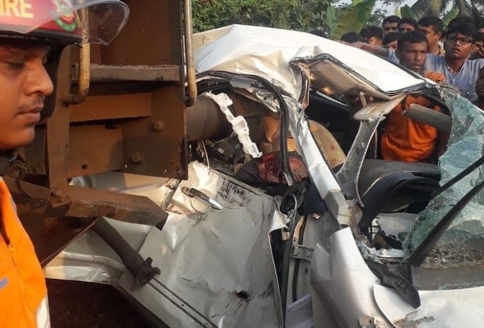 Mangled private car after it was rammed by a train at Bhangagate railway crossing in Jashore's Abhaynagar on Friday