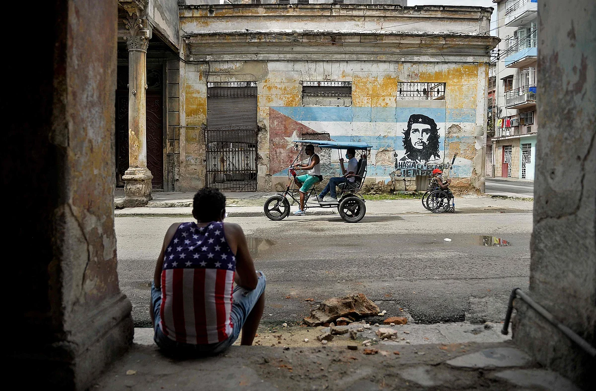Man wearing a tank top with a design of the US flag rests in Havana on 21 October 2020, amid the COVID-19 novel coronavirus pandemic.