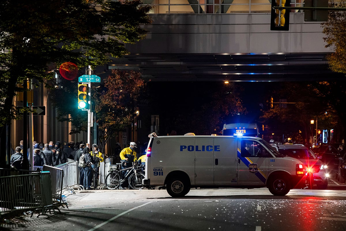 Philadelphia Police officers stand guard near Pennsylvania Convention Center after probing alleged plot to attack vote counting venue of the 2020 US presidential election in Philadelphia, Pennsylvania, US, 6 November, 2020.