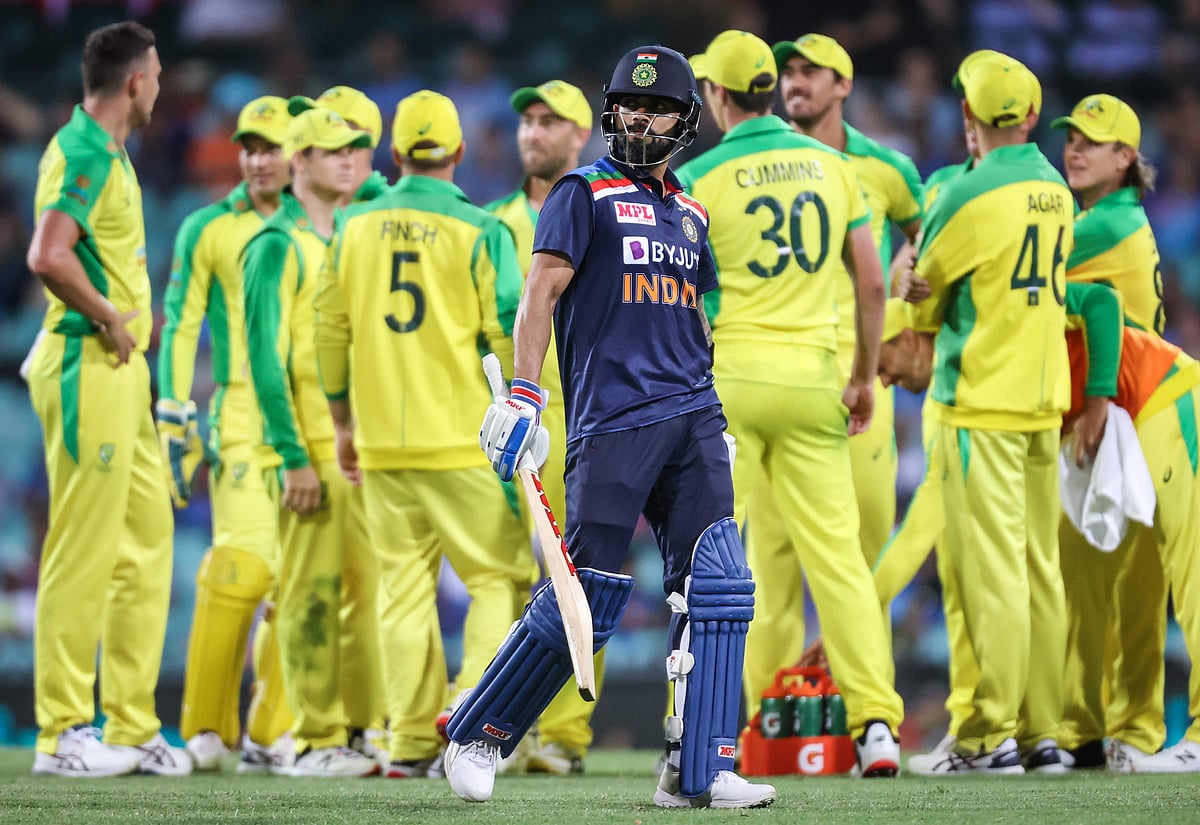 India's captain Virat Kohli (C) reacts as he walks off the ground after being dismissed by Australia's Josh Hazlewood during the one-day cricket match at the Sydney Cricket Ground (SCG) in Sydney on 29 November 2020