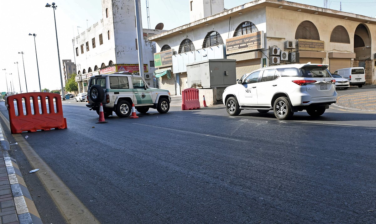 Saudi police close a street leading to a non-Muslim cemetery in the Saudi city of Jeddah where a bomb struck a World War I commemoration attended by European diplomats on 11 November, 2020 leaving several people wounded amid Muslim anger over French cartoons.