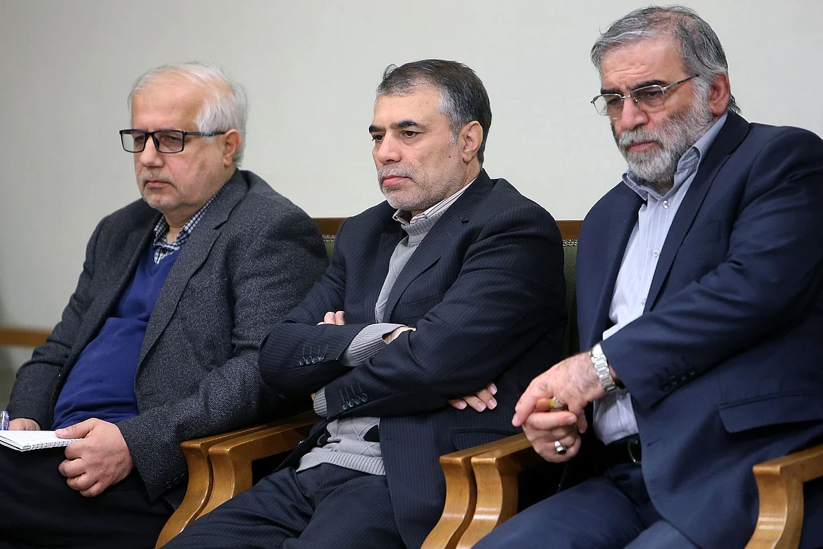 A handout picture provided by the Iranian supreme leader's official website on 27 November, 2020, shows Iranian scientist Mohsen Fakhrizadeh (R) during a meeting with the Iranian supreme leader