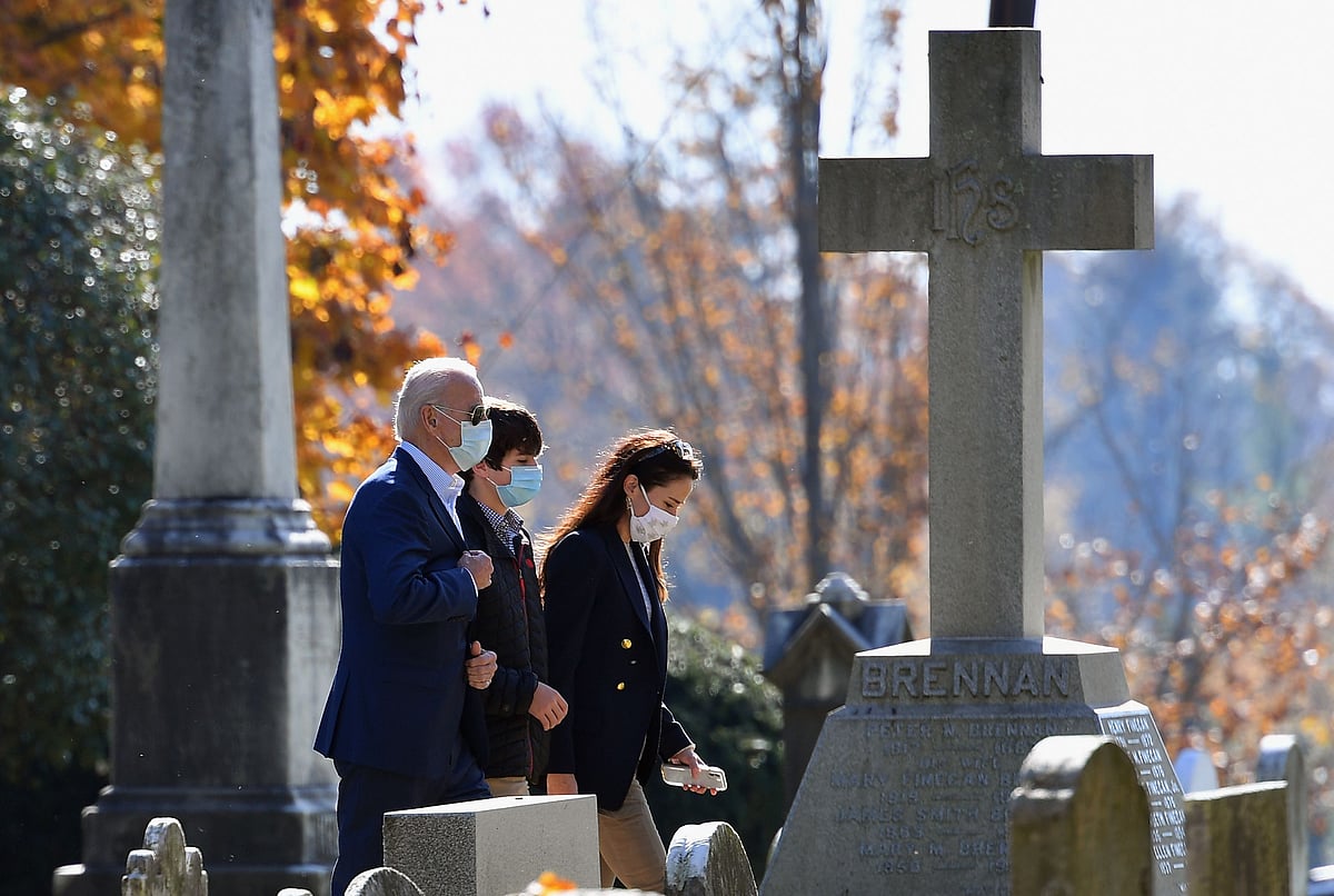 US president-elect Joe Biden(L) arrives at St. Joseph on the Brandywine Roman Catholic Church in Wilmington, Delaware on 8 November, 2020.