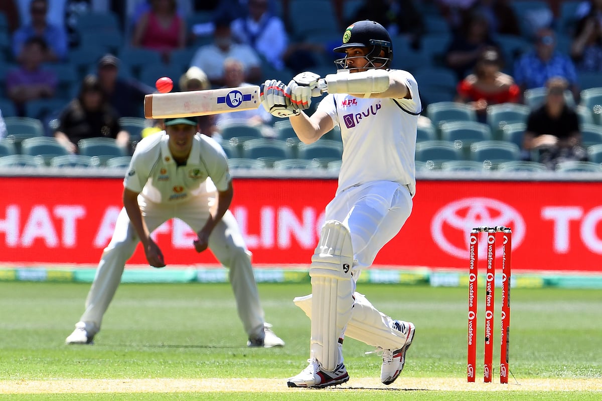 India's Umesh Yadav tips the ball to be caught behind from a ball by Australia's paceman Mitchell Starc on day two of the first cricket Test match between Australia and India in Adelaide on 18 December 2020