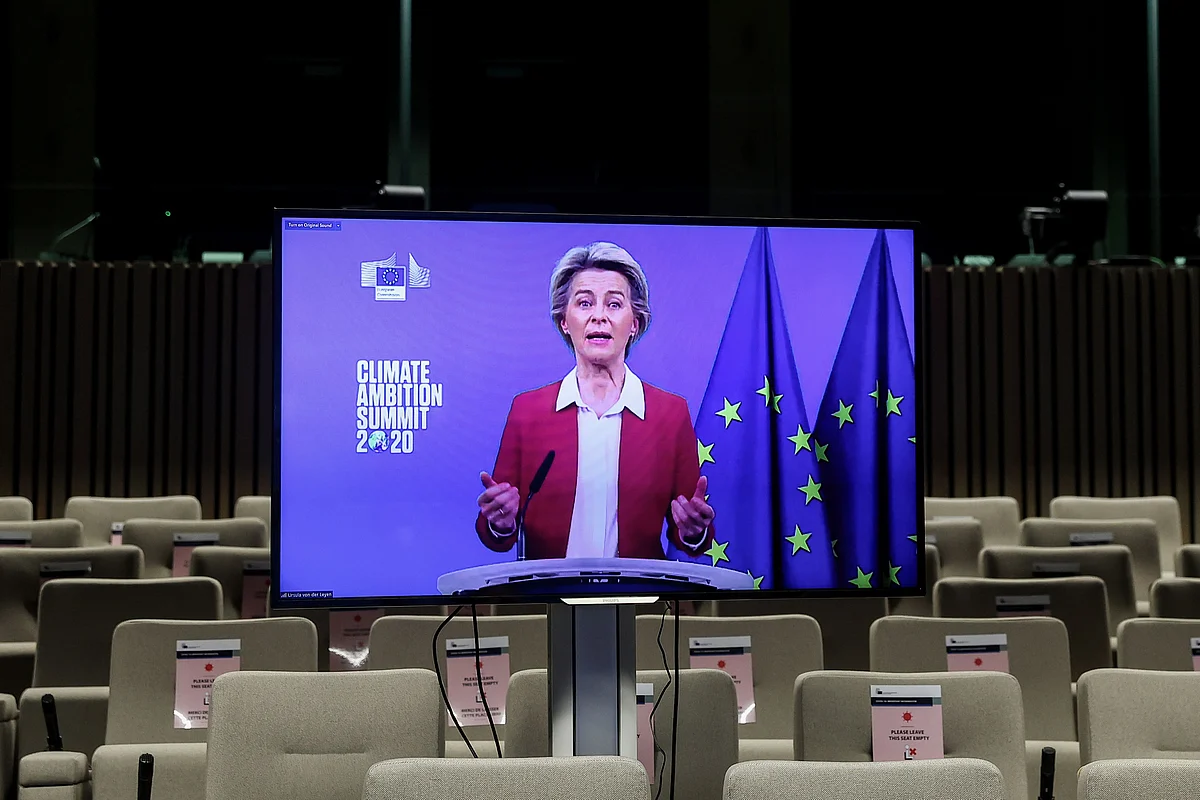 President of the European Commission Ursula von der Leyen appears on a screen to deliver a speech during the Climate Ambition Summit 2020 in Brussels on 12 December 2020 as this year marks the fifth anniversary of the Paris Agreement adopted by 196 countries on 12 December 2015