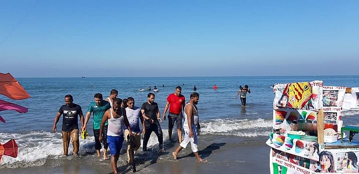 Tourists emerging from the sea at Saint Martin's