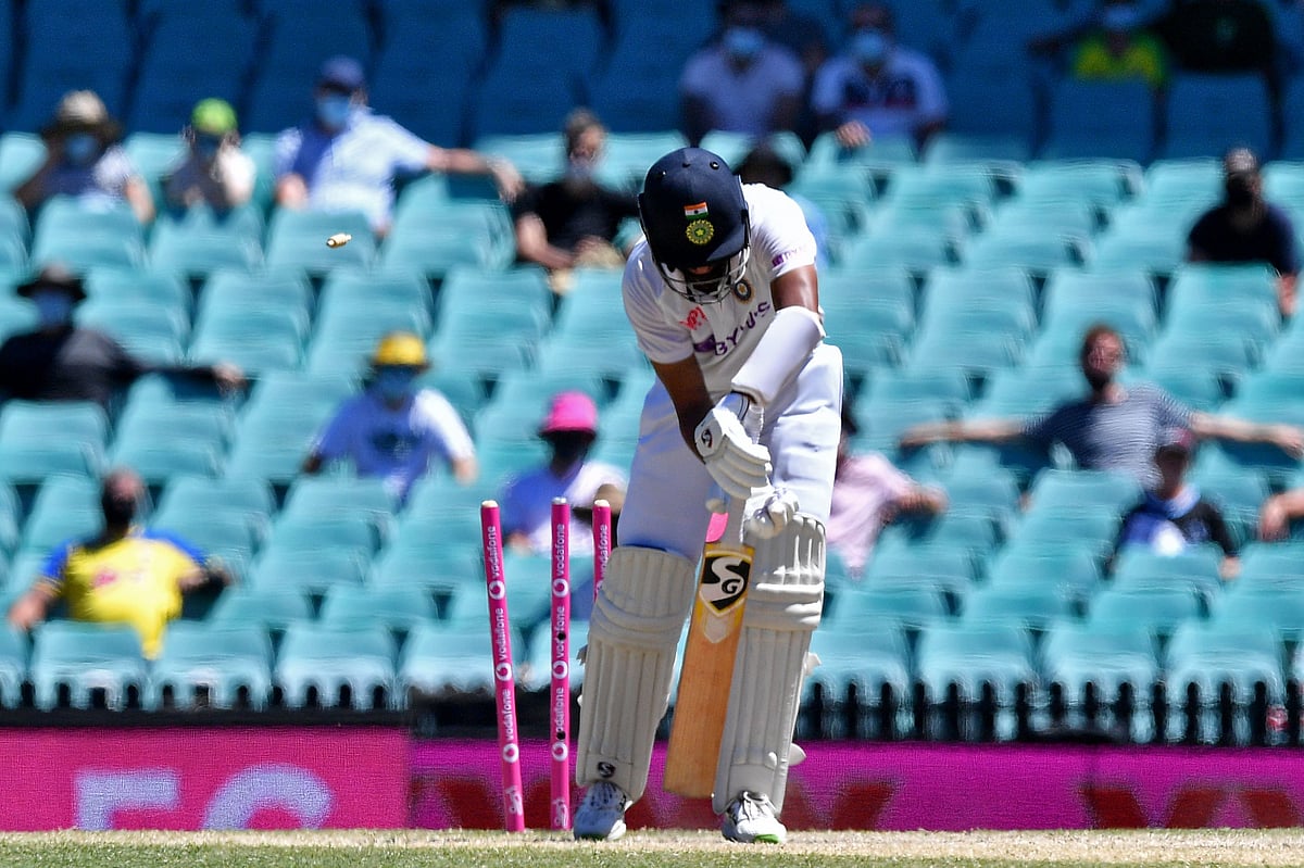 India's Cheteshwar Pujara is clean bowled by Australia's Josh Hazlewood during the fifth day of the third cricket Test match between Australia and India at the Sydney Cricket Ground (SCG) in Sydney on 11 January, 2021
